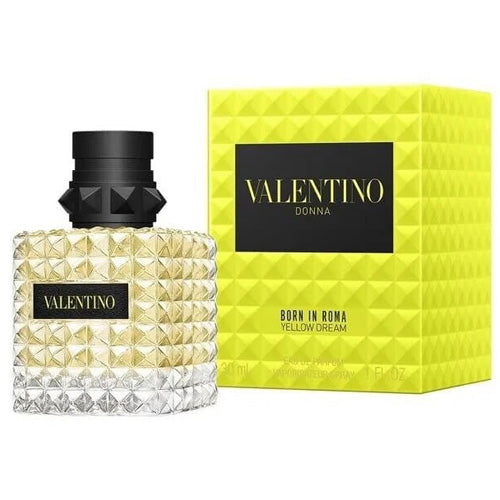 Valentino Donna Born In Roma Yellow Dream Eau de Parfum 100ml, a sophisticated scent in a radiant yellow studded glass bottle, paired with a sleek black stopper and branding to embody joy, femininity, and contemporary luxury.
