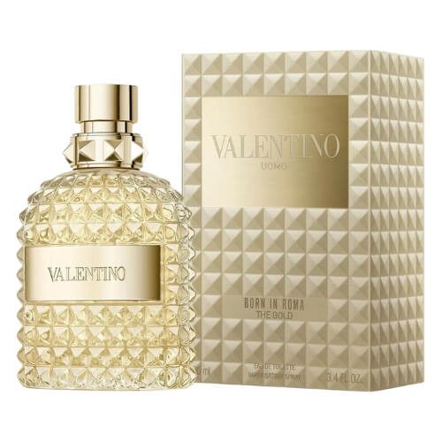 Valentino Uomo Born In Roma The Gold Eau de Toilette 100ml, a bold men’s fragrance presented in a faceted rockstud-inspired glass bottle with a radiant golden hue, paired with a sleek black cap and label that symbolize strength and modern elegance.