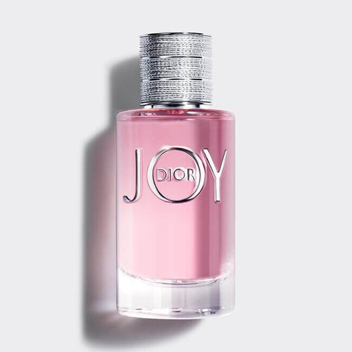 Christian Dior Joy Eau de Parfum, 90ml modern women’s fragrance with citrus, floral, and woody notes in a round transparent glass bottle with silver detailing.