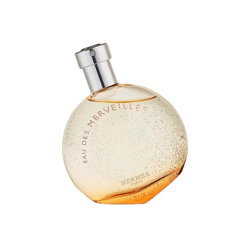 100ml Hermès Eau des Merveilles EDT, luxurious and sparkling women’s fragrance in an amber-colored round glass bottle with silver detailing.