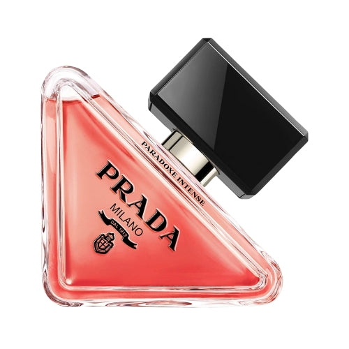 Prada Paradoxe Intense Eau de Parfum 90 ml: clear glass bottle with amber liquid, silver stopper, and subtle branding.