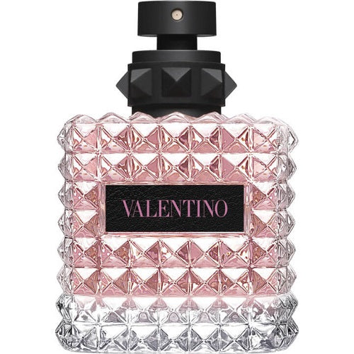 Valentino Donna Born In Roma Eau de Parfum 100ml, a designer scent captured in a beautifully detailed pink glass bottle with signature rockstud textures, contrasted by a matte black cap and label for a chic, edgy aesthetic.