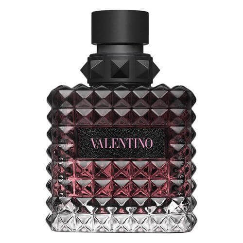 Valentino Donna Born In Roma Intense Eau de Parfum Intense 100ml, a sophisticated fragrance captured in a radiant faceted glass flacon with glowing pink-gold tones, finished with a matte black cap and label for a bold, contemporary edge.