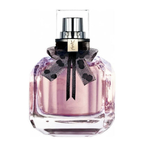 Yves Saint Laurent Mon Paris Eau de Toilette 90ml, presented in a clear pink glass bottle with rounded edges, silver YSL logo, and sleek spray top, embodying romance, feminine allure, and contemporary elegance.